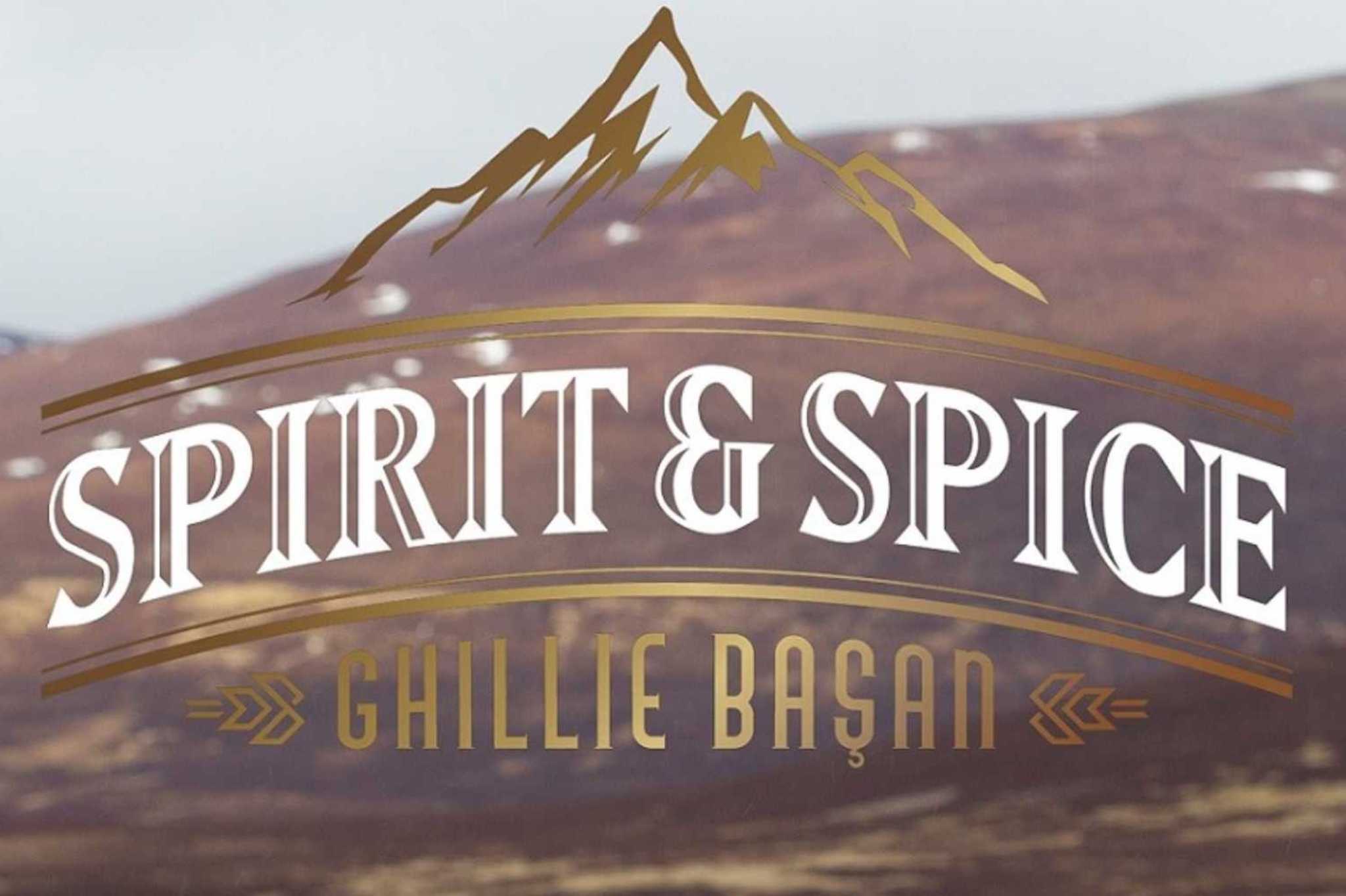 Spirit and Spice Ghillie Başan logo superimposed over an image of a hillside
