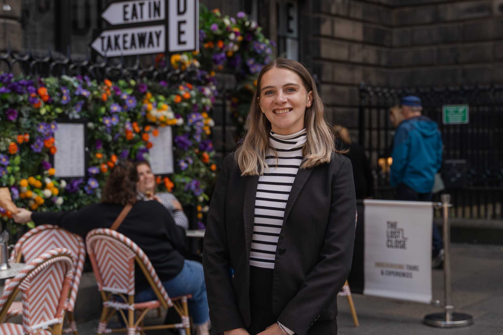 Katie Scott, Head of Events and Experience stands outside The Lost Close