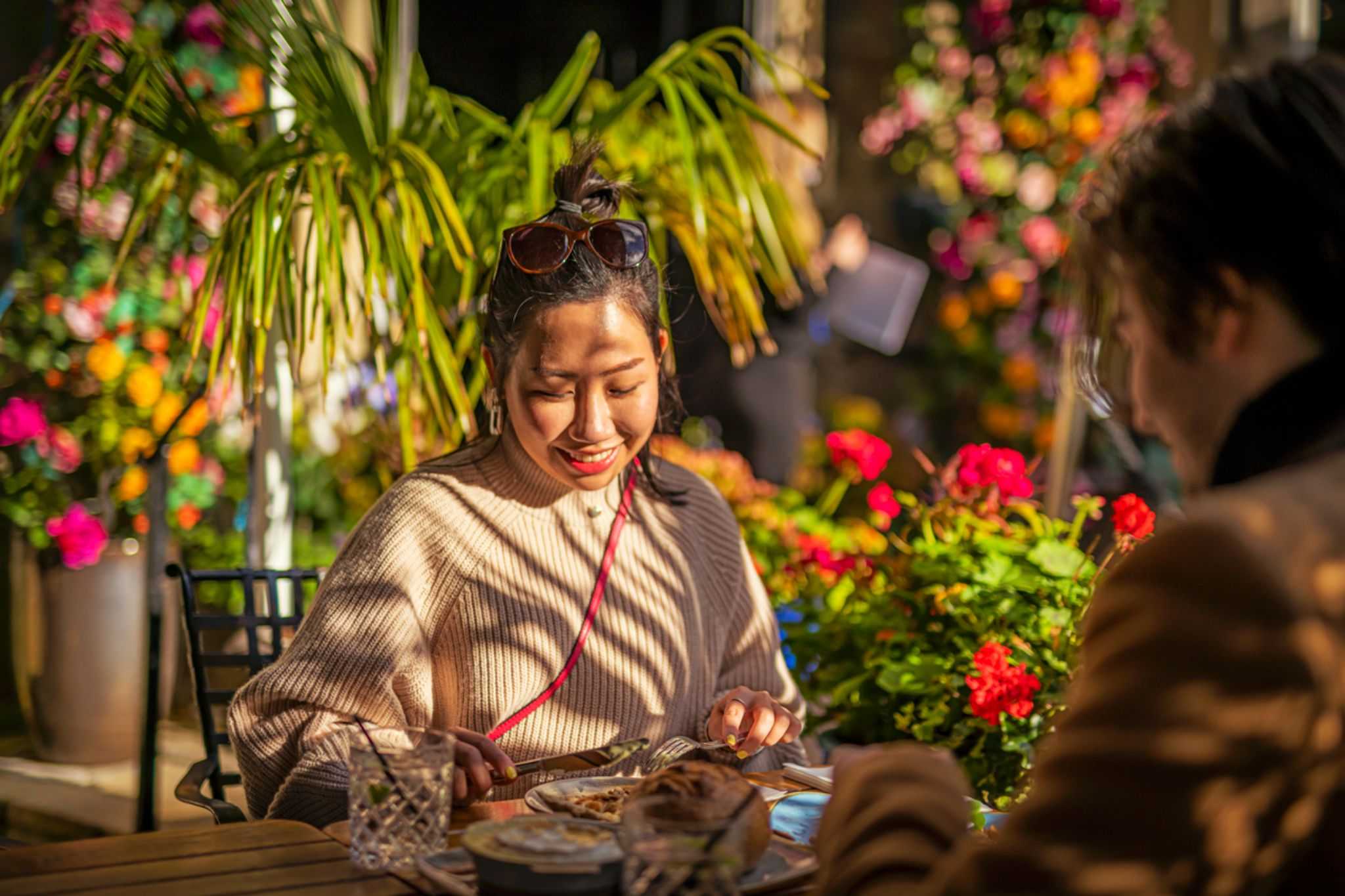 A couple are sitting at a table eating