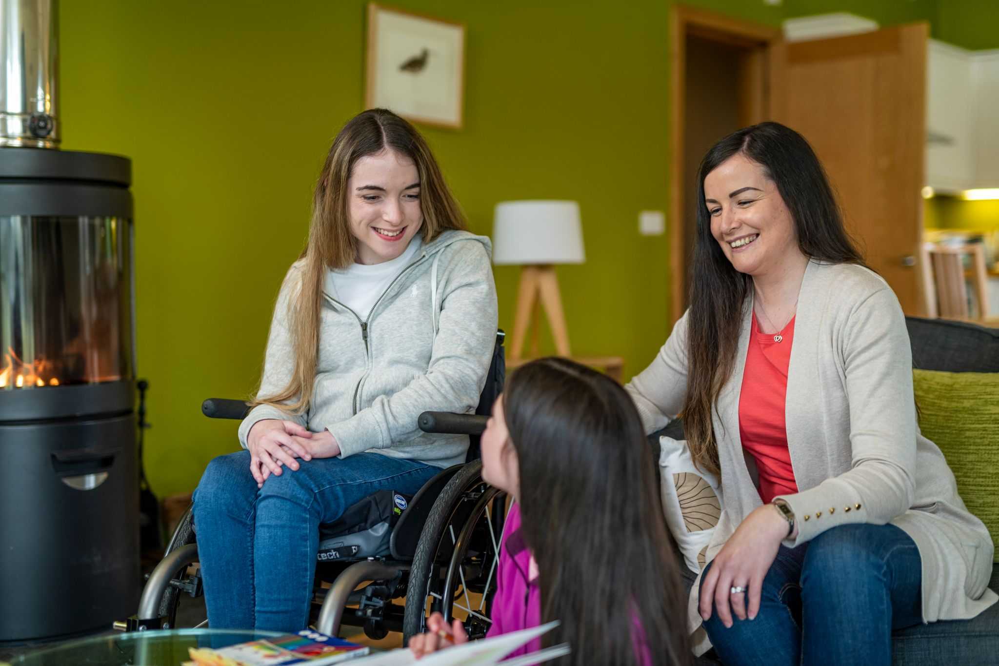 A wheelchair guest and her family enjoying self catering accommodation